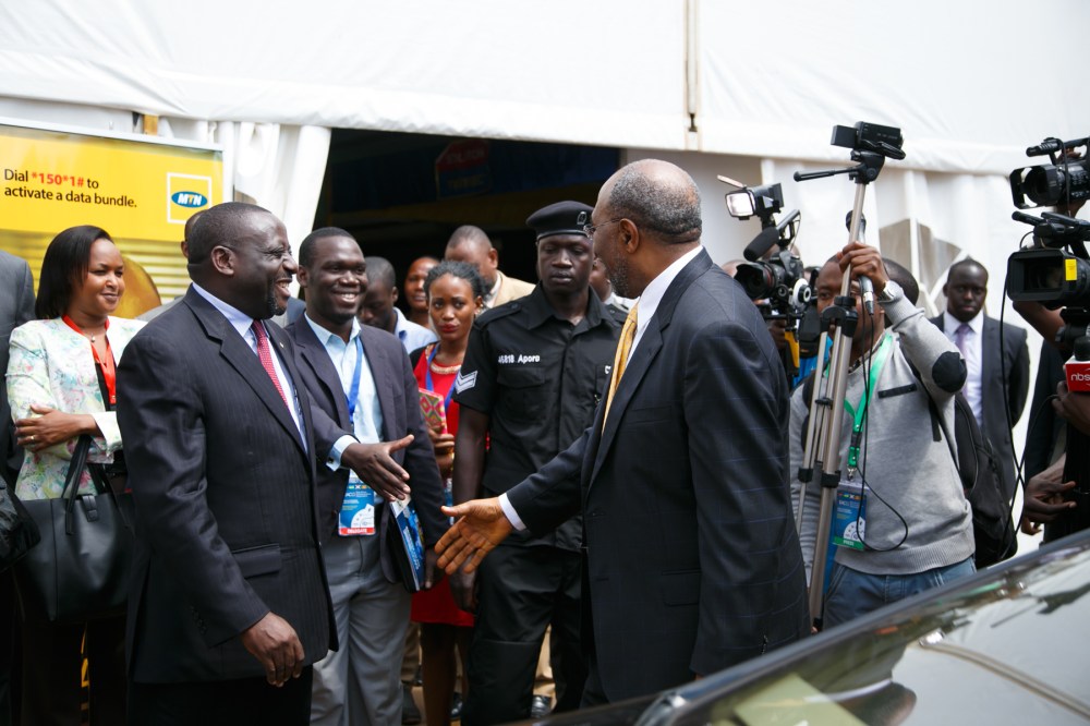 Rt Hon Ruhakana Rugunda moves to shake hands with Hon Kivumbi Earnest Benjamin before Journalists and International Government Figures