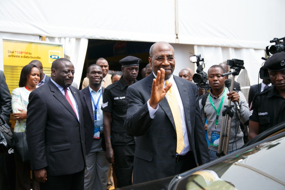 Rt Hon Dr Ruhakana Rugundawaves at Delegates alongside Kivumbi Earnest Benjamin, Journalists and International Government Figures
